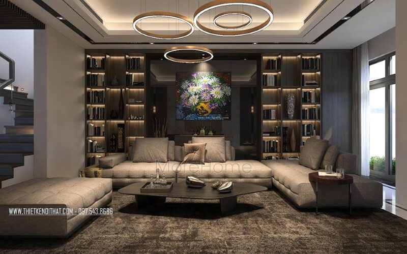 Bố trí nội thất phòng khách hiện đại, đẹp với bộ bàn ghế sofa lớn, kệ ốp tường, tranh treo tường. Thiết kế biệt thự