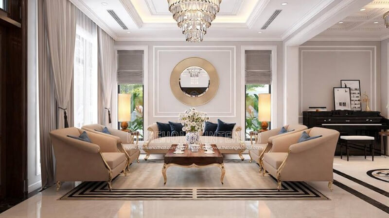 Bộ bàn ghế sofa tân cổ điển mạ vàng tone trắng sữa nhẹ nhàng nhưng lại tạo điểm nhấn đẹp, sang trọng cho phòng khách. Thiết kế phòng khách biệt thự