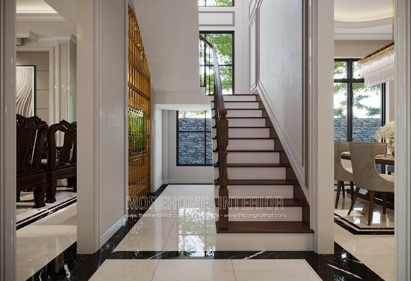 Thiết kế cửa kính cường lực khu vực cầu thang thông tầng giúp không gian trở nên thông thoáng. thiết kế biệt thự