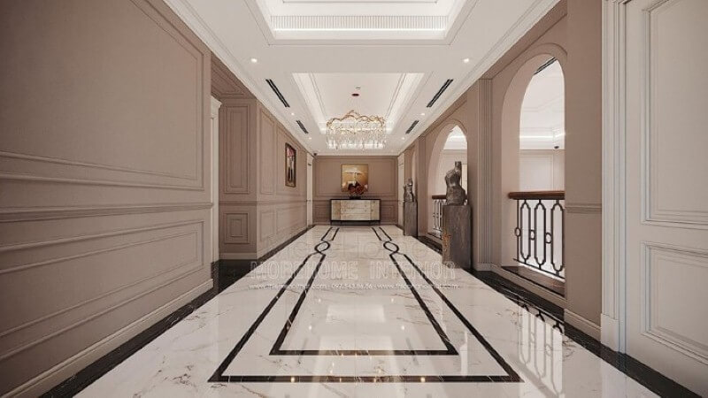 Trang trí hành lang đẹp ấn tượng từ sàn lát đá cao cấp, phào chỉ tường đẹp cùng đèn trang trí pha lê ấn tượng. thiết kế biệt thự