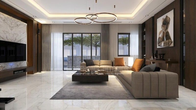 Mẫu thiết kế nội thất phòng khách biệt thự cao cấp sử dụng phong cách bố trí nội thất hiện đại cùng cách trang trí đặc biệt khi sử dụng gỗ ốp tường vật liệu đòi hỏi năng lực thi công chuyên nghiệp cùng sự đầu tư không nhỏ từ khối đá đối vân, nền lớn đá. Thiết kế nội thất biệt thự